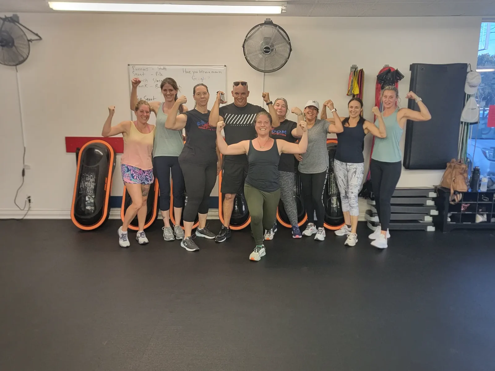Freedom Fitness group class members celebrating together